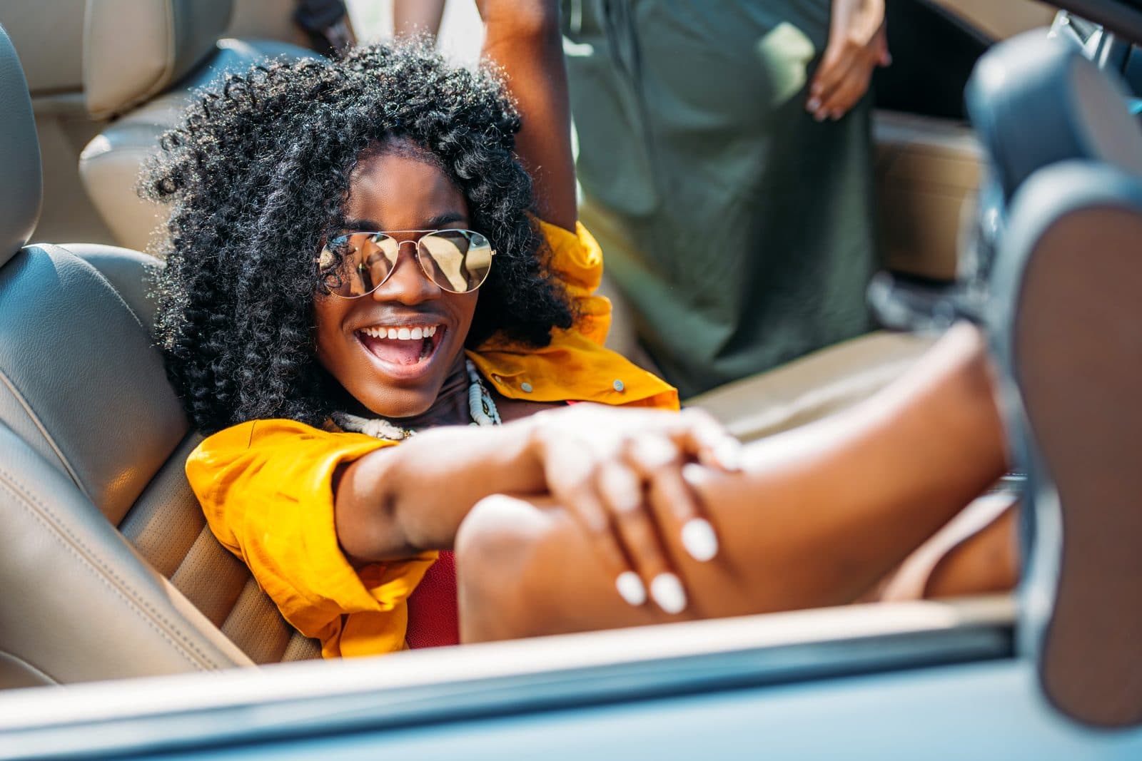 Smiling WopeCar renter driving with confidence