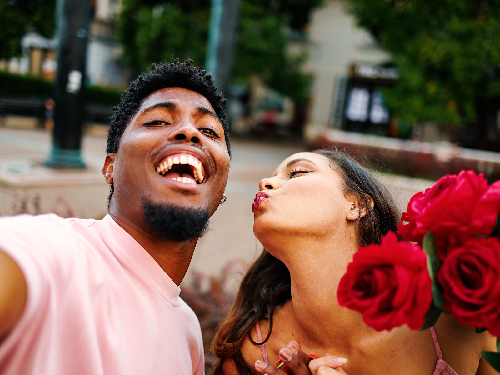 Young happy couple taking a selfie on the street by djile