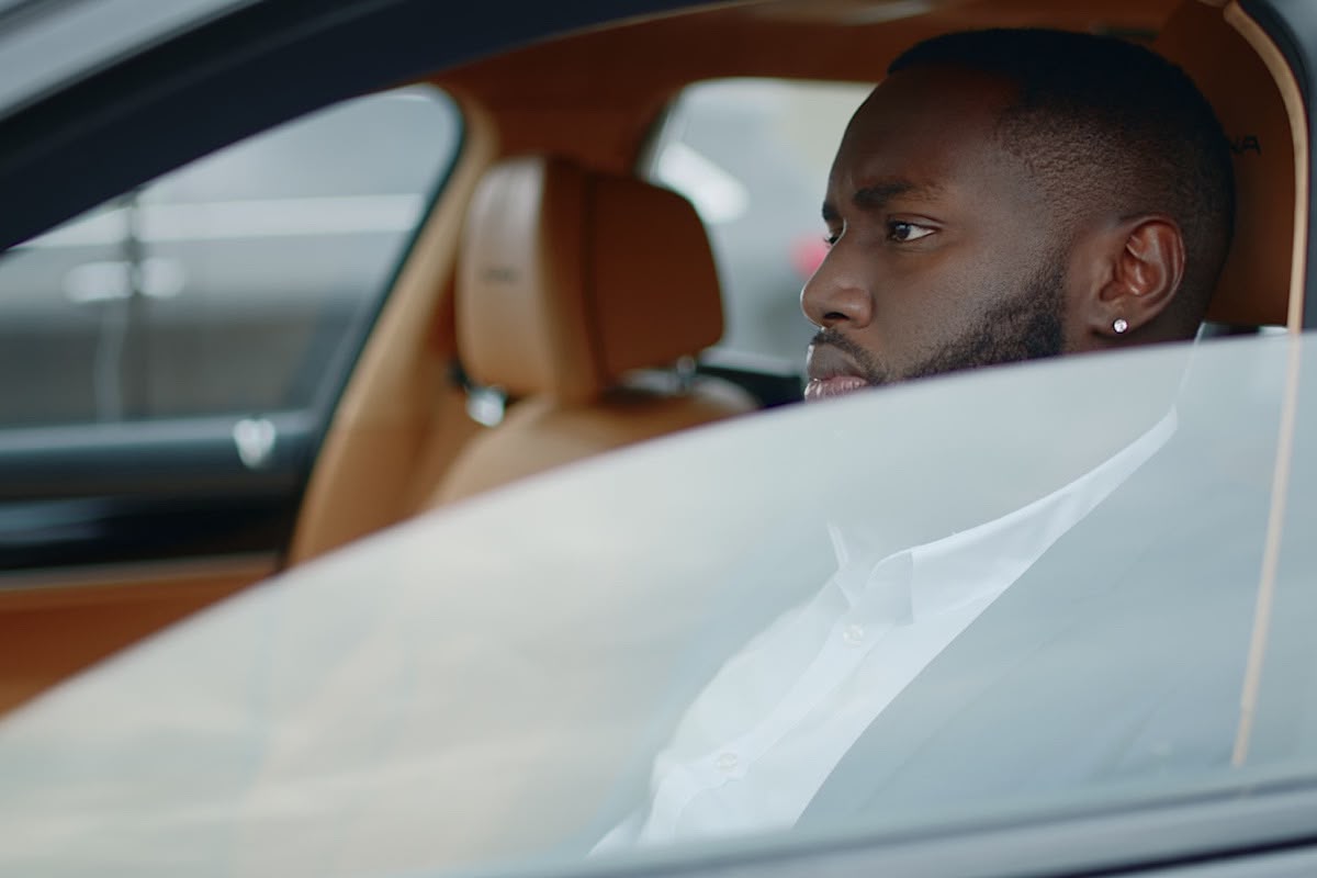 Man in Car Wearing White Shirt and Suit by DepictionImages