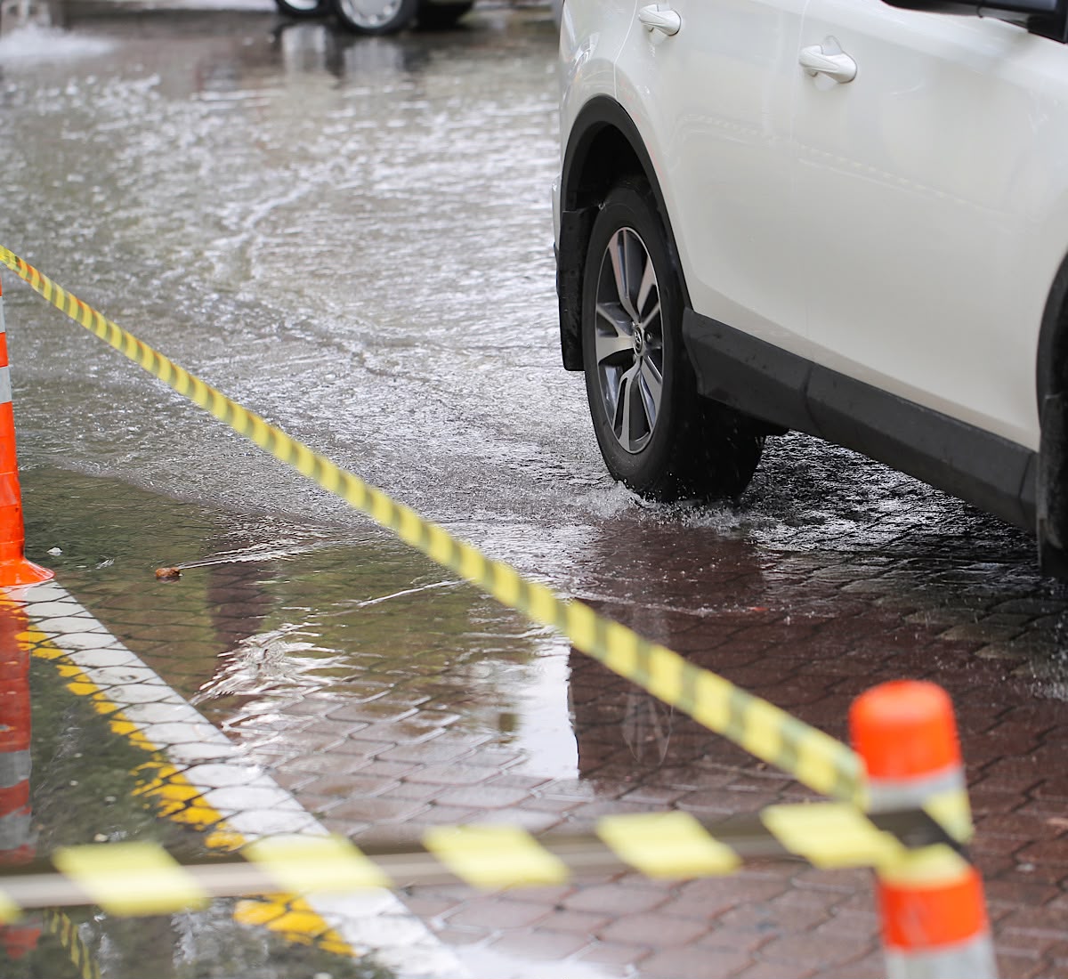 Flooded Street After Heavy Rain with Caution Tape by ShadowInspiration